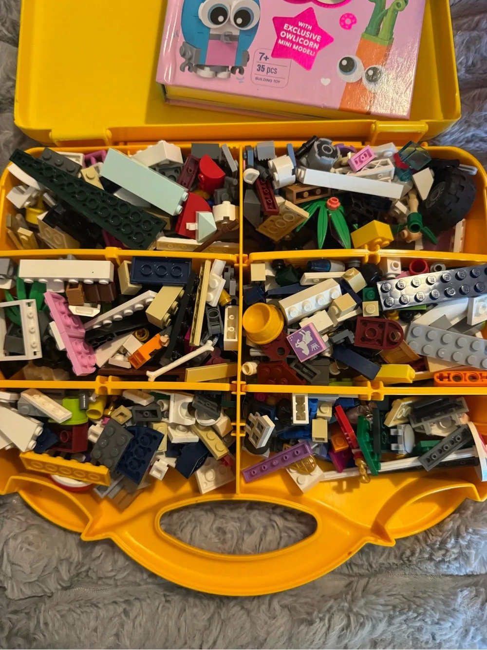 Lego Yellow and Orange Carry Cases filled with Lego bricks and a bag of boards